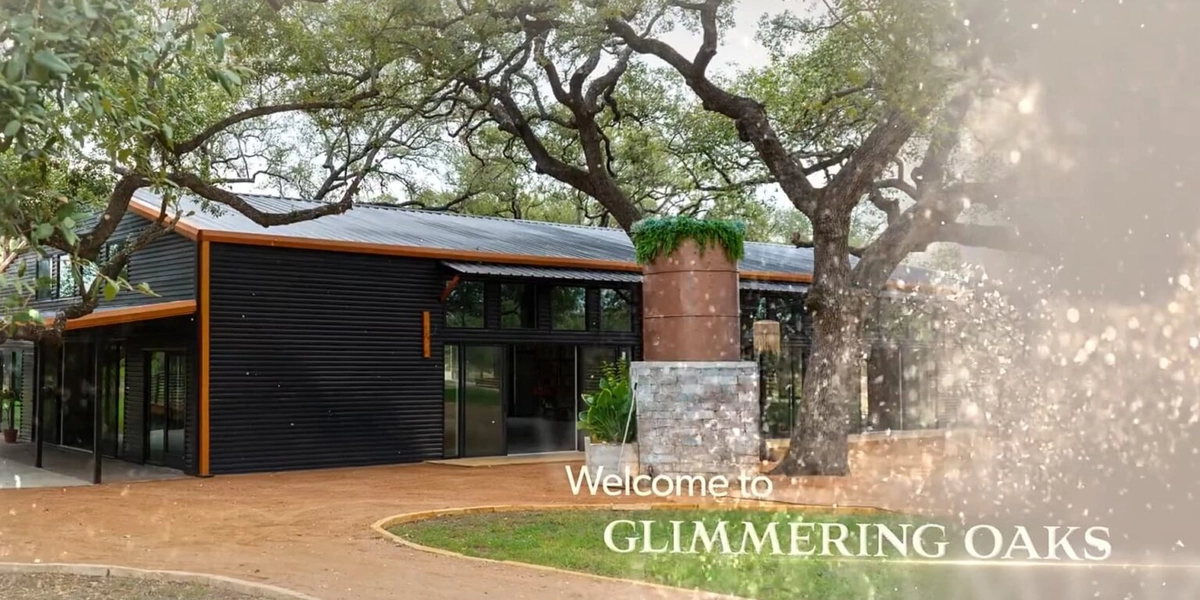 Entrance to Glimmering Oaks Event Center beneath heritage oak trees near San Antonio