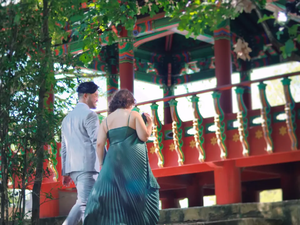Couple walking toward the Korean Pavilion together during their San Antonio engagement session