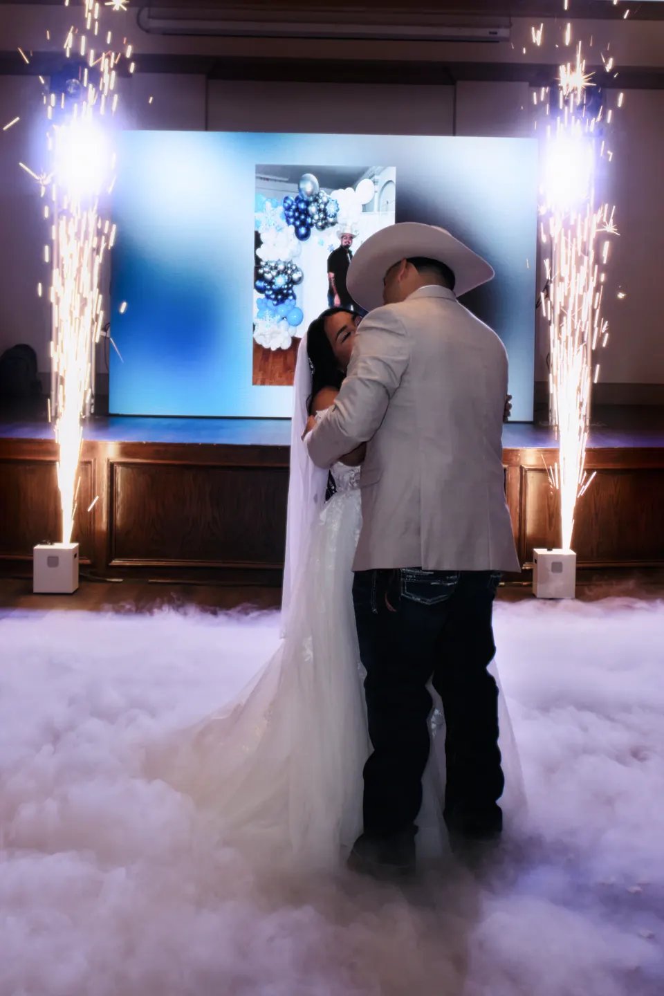 First dance surrounded by cold sparklers and fog at the Phoenician Ballroom Event Center reception in San Antonio