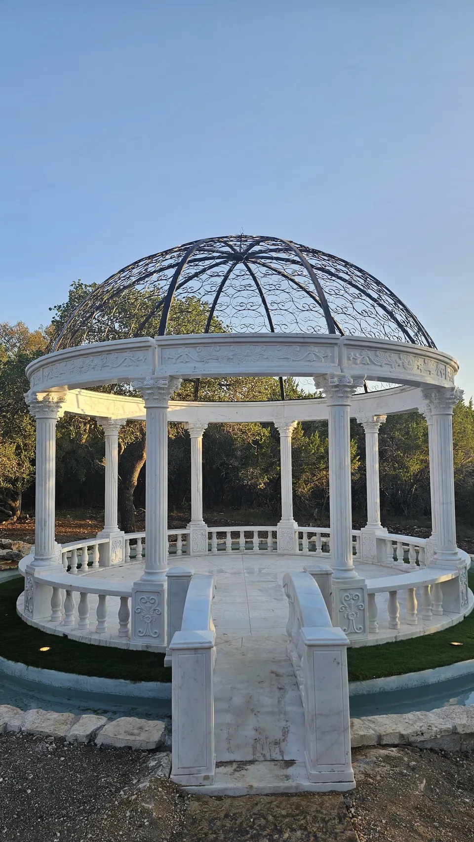 Marble bridge over the fountain moat leading into the marble dome at Prima Vista in Wimberley, Texas