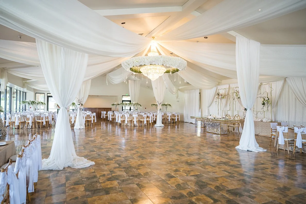 Draped reception hall with chandelier at Granberry Hills Event Facility